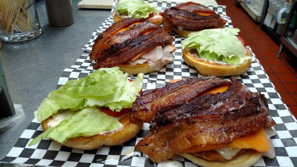 Smoked barbecue plates on a casual table.
